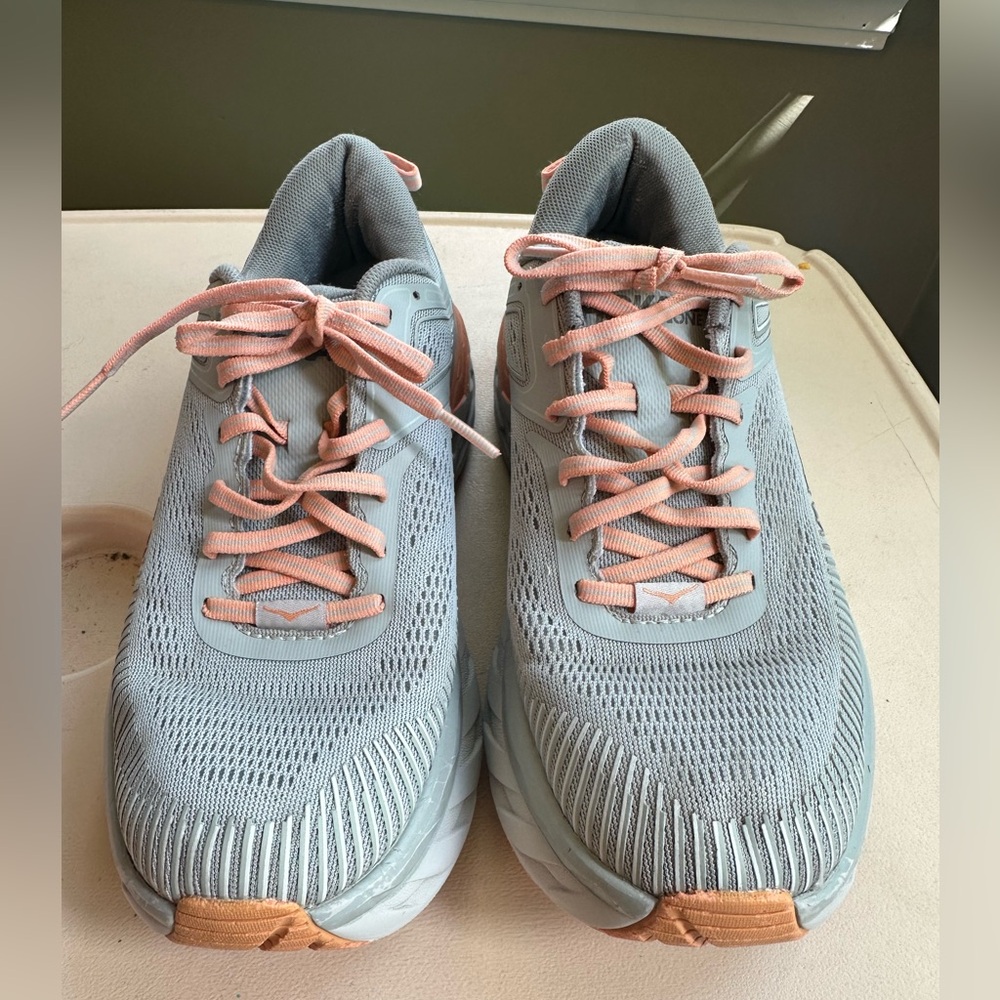 Hoka Grey and light orange shoes
